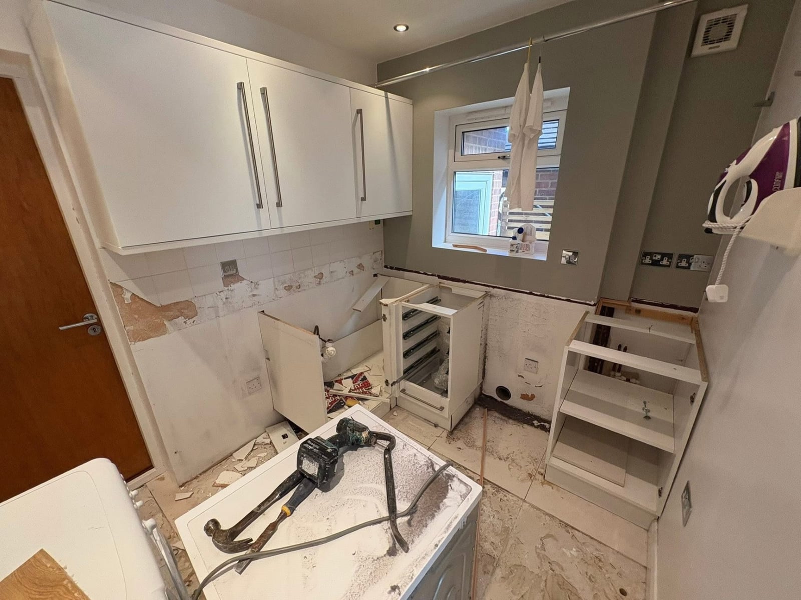 Kitchen and utility room stripped back to bare units during renovation